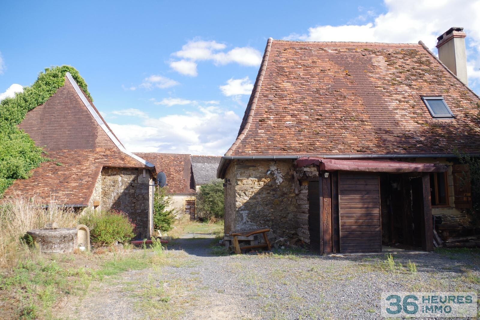 Ensemble immobilier - maison + grange + dépendances sur vaste terrain